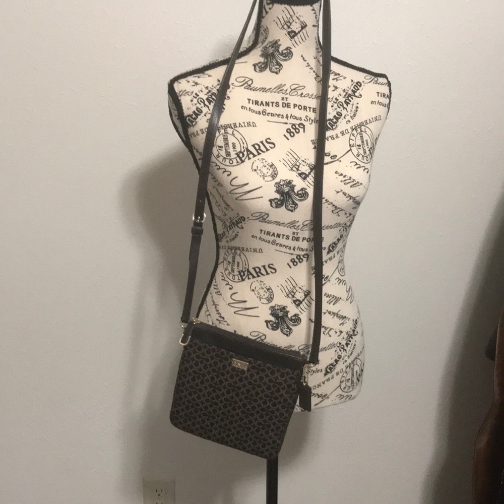 COACH crossbody in brown and tan colors,